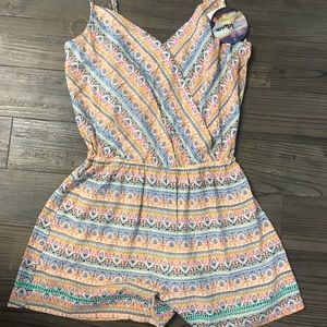 Never used and super cute with tags romper sz S